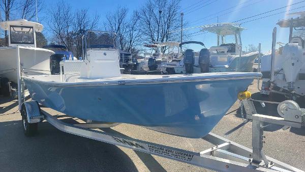 Slide: The Image of 2024 Lookout Skiff Bay 19 boat on a trailer in a marina. - 8