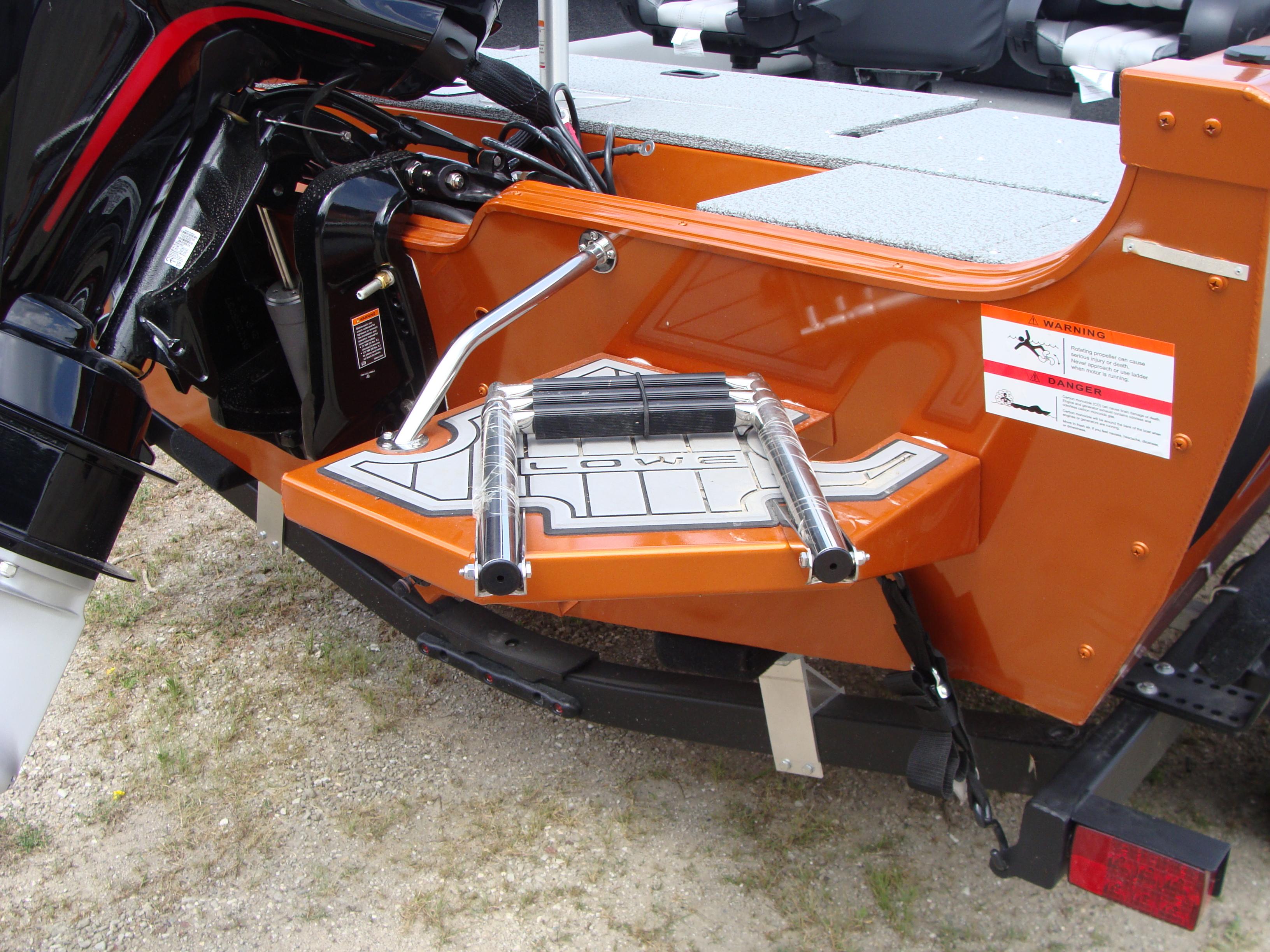 Slide: The Image of 2023 Lowe FS 1900 boat stern with motor and swim platform. - 5