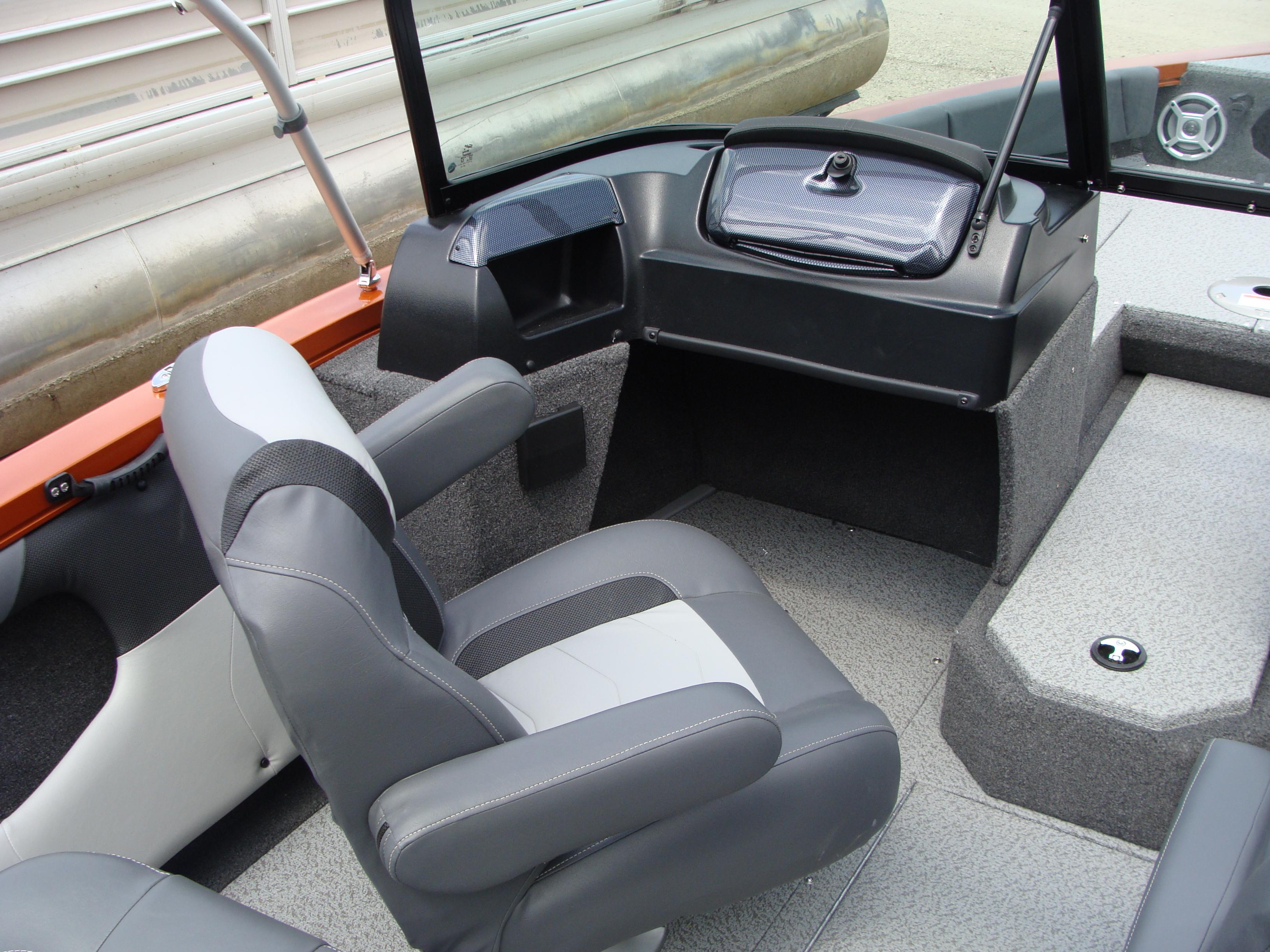 Slide: The Image of 2023 Lowe FS 1900 boat interior with gray seating and dashboard. - 7
