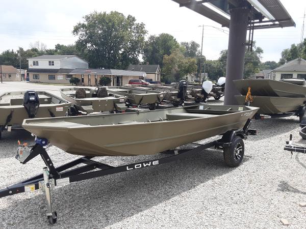 Slide: The Image of 2024 Lowe Jon L1648M boat on trailer in outdoor dealership lot. - 1