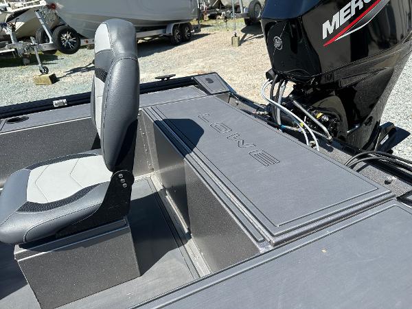Slide: The Image of 2022 Lowe Skorpion 16 boat interior with Mercury engine. - 11