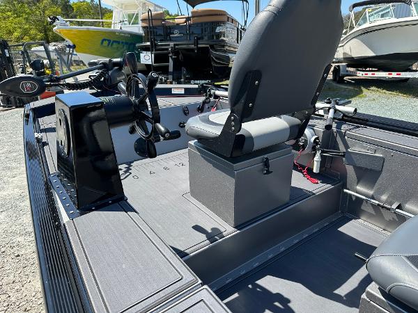 Slide: The Image of 2022 Lowe Skorpion 16 fishing boat interior with steering console and seating. - 14
