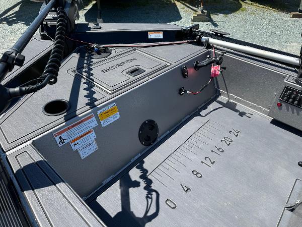 Slide: The Image of 2022 Lowe Skorpion 16 boat interior with measurement markings and control panel. - 15