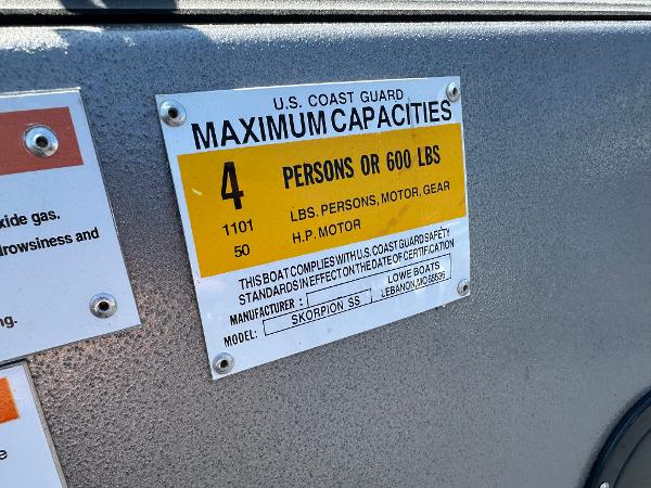 Slide: The Image of 2022 Lowe Skorpion 16 boat capacity label, 4 persons or 600 lbs, 50 HP motor. - 17
