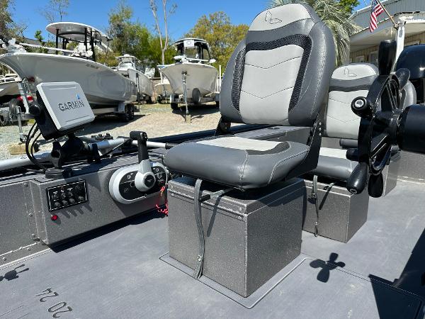 Slide: The Image of 2022 Lowe Skorpion 16 boat interior with Garmin navigation system and comfortable seating. - 18
