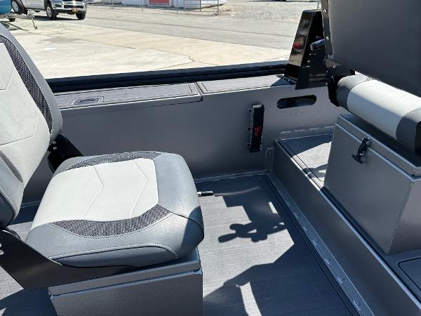 Slide: The Image of Interior seating of a 2022 Lowe Skorpion 16 boat with gray and black upholstery. - 21