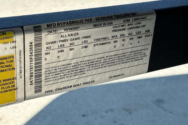 Slide: The Image of 2022 Lowe Skorpion 16 trailer label with specifications and safety information. - 26
