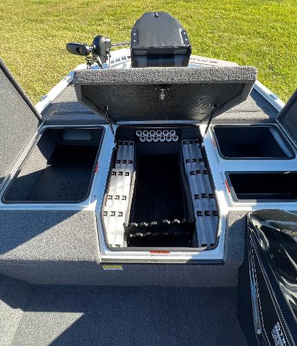 Slide: The Image of 2024 Lowe Stinger 188 SC boat with open storage compartments. - 6
