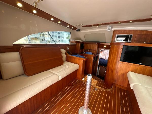 Slide: The Image of Interior of 1993 Luhrs 320 Tournament boat with wood finish and seating area. - 15