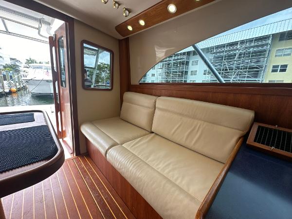Slide: The Image of Interior of 1993 Luhrs 320 Tournament boat with beige leather seating and wooden accents. - 17