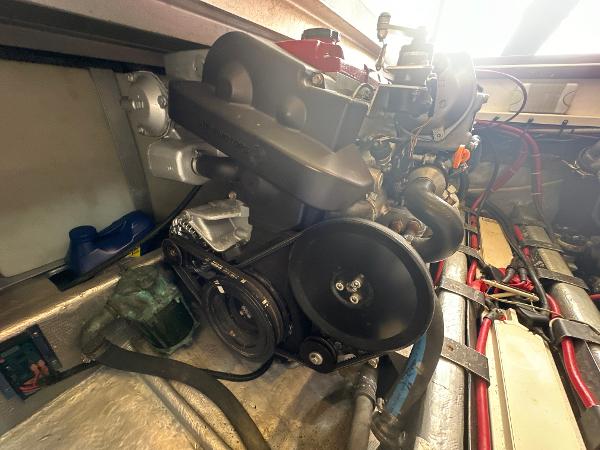 Slide: The Image of Engine compartment of a 1993 Luhrs 320 Tournament boat, showcasing mechanical components. - 25