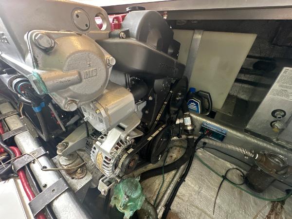 Slide: The Image of Engine compartment of a 1993 Luhrs 320 Tournament boat, showing mechanical components and wiring. - 26