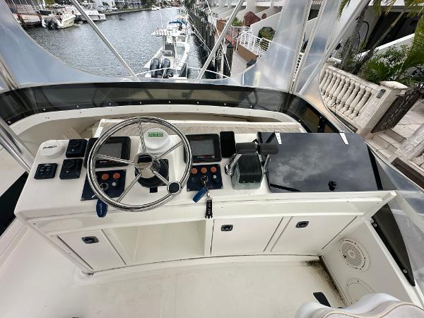 Slide: The Image of 1993 Luhrs 320 Tournament boat helm with steering wheel and control panel. - 27
