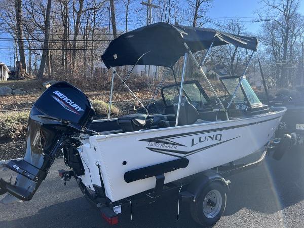 Slide: The Image of 2024 Lund 1650 Angler Sport boat with Mercury outboard motor. - 3