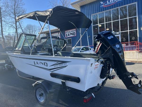 Slide: The Image of 2024 Lund 1650 Angler Sport boat with Mercury 60 HP outboard motor. - 4