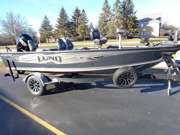 Slide: The Image of 2024 Lund 1875 Pro Guide fishing boat on a trailer. - 0