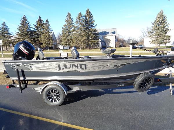 Slide: The Image of 2024 Lund 1875 Pro Guide fishing boat on trailer. - 1