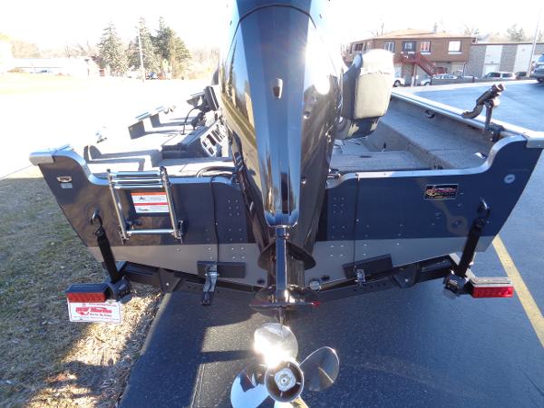 Slide: The Image of 2024 Lund 1875 Pro Guide boat rear view with outboard motor. - 18