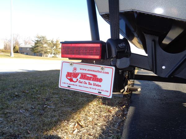 Slide: The Image of 2024 Lund 1875 Pro Guide boat trailer with license plate and tail light. - 19