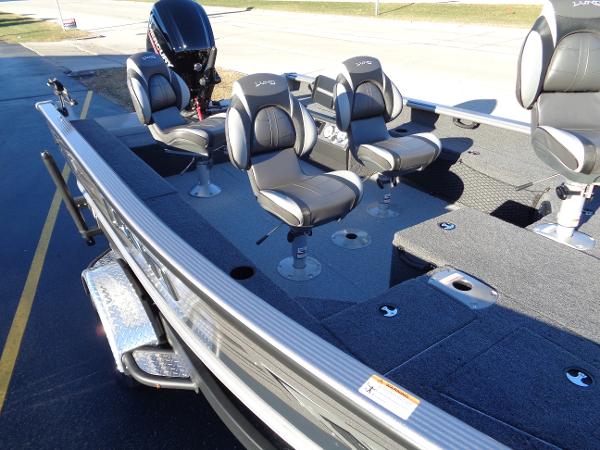 Slide: The Image of 2024 Lund 1875 Pro Guide fishing boat with swivel seats and outboard motor. - 23
