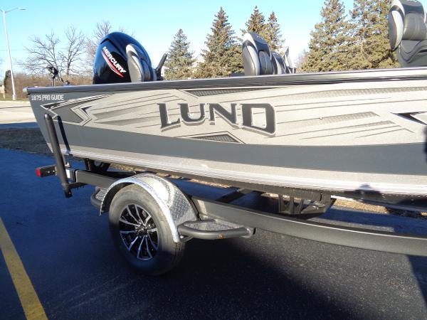Slide: The Image of 2024 Lund 1875 Pro Guide fishing boat on trailer. - 24