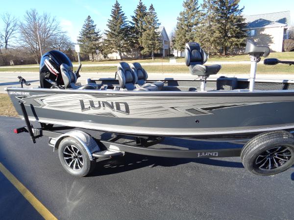 Slide: The Image of 2024 Lund 1875 Pro Guide fishing boat on trailer, side view. - 3
