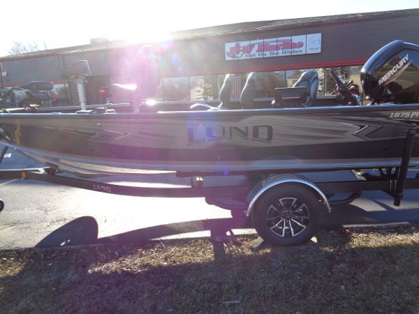 Slide: The Image of 2024 Lund 1875 Pro Guide fishing boat on trailer, side view. - 31