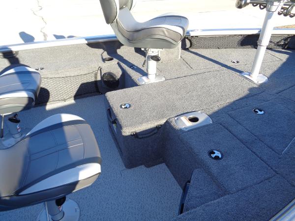 Slide: The Image of 2024 Lund 1875 Pro Guide boat interior with seating and storage compartments. - 32