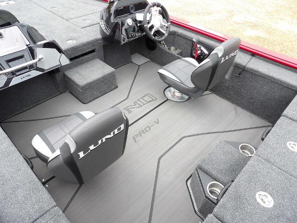 Slide: The Image of 2024 Lund 2075 Pro-V Bass XS interior with dual seats and steering console. - 10