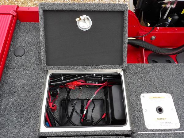 Slide: The Image of Open battery compartment of 2024 Lund 2075 Pro-V Bass XS boat. - 13