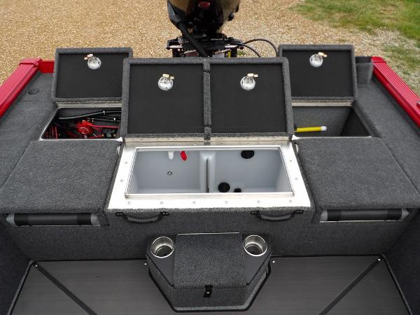 Slide: The Image of 2024 Lund 2075 Pro-V Bass XS boat with open storage compartments and livewell. - 14
