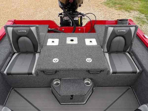 Slide: The Image of 2024 Lund 2075 Pro-V Bass XS boat interior with seating and storage compartments. - 17