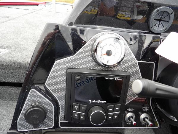 Slide: The Image of 2024 Lund 2075 Pro-V Bass XS dashboard with Rockford Fosgate audio system and gauge. - 21