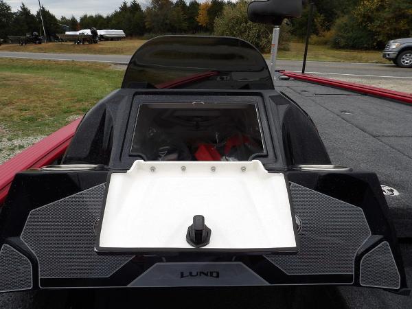 Slide: The Image of 2024 Lund 2075 Pro-V Bass XS boat with open storage compartment. - 25