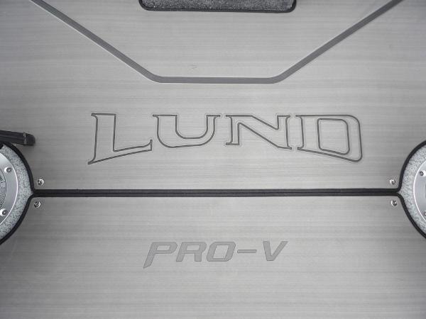 Slide: The Image of 2024 Lund 2075 Pro-V Bass XS boat deck with logo. - 28