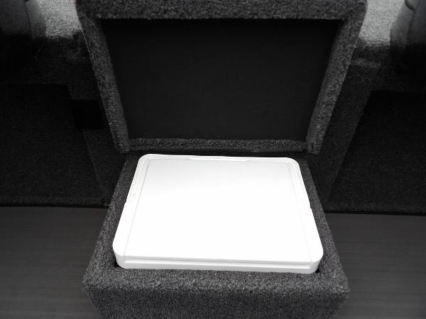 Slide: The Image of 2024 Lund 2075 Pro-V Bass XS storage compartment with white lid. - 29