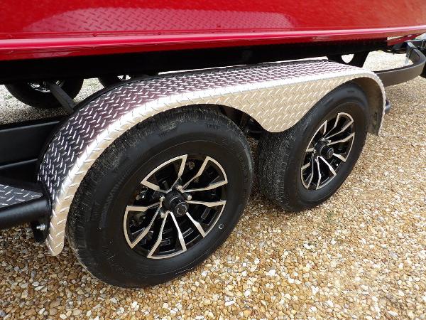 Slide: The Image of 2024 Lund 2075 Pro-V Bass XS trailer with dual black alloy wheels. - 41
