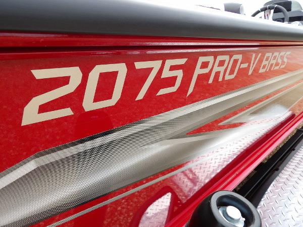 Slide: The Image of 2024 Lund 2075 Pro-V Bass XS boat side view with model name. - 49