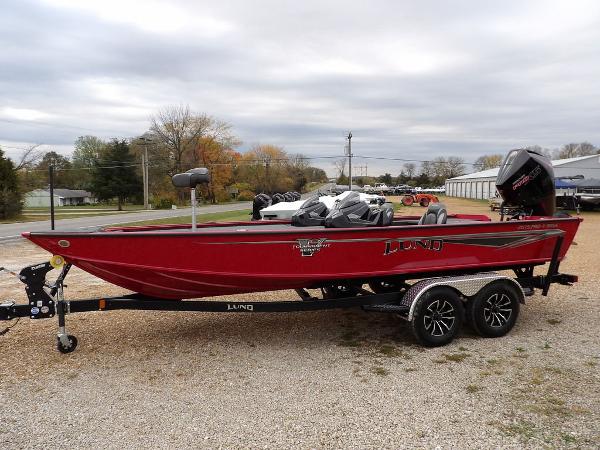 Slide: The Image of 2024 Lund 2075 Pro-V Bass XS red fishing boat on trailer. - 6