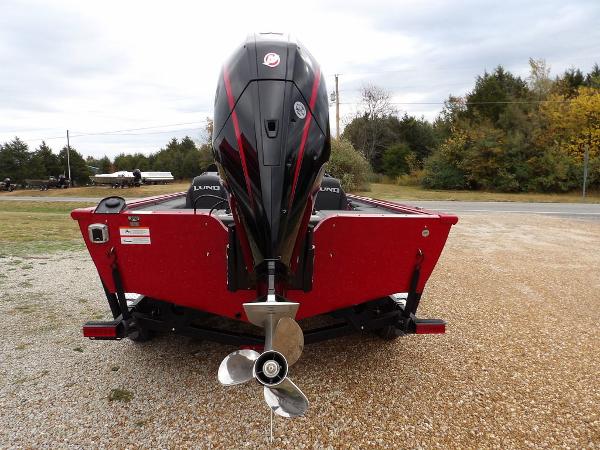 Slide: The Image of 2024 Lund 2075 Pro-V Bass XS boat rear view with outboard motor. - 7