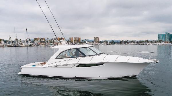 Slide: The Image of 2023 Mag Bay 42 Express yacht on calm water, showcasing sleek design and modern features. - 0