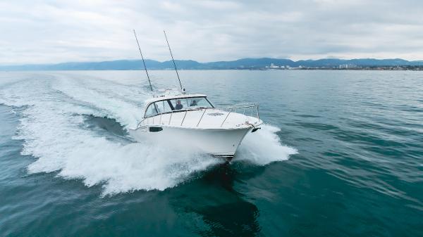 Slide: The Image of 2023 Mag Bay 42 Express cruising on open water, showcasing sleek design and performance. - 1