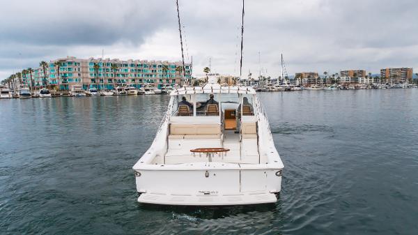 Slide: The Image of 2023 Mag Bay 42 Express yacht in marina, overcast sky, waterfront buildings in background. - 18
