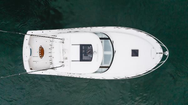 Slide: The Image of Aerial view of 2023 Mag Bay 42 Express boat on water. - 27