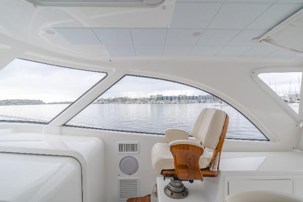 Slide: The Image of Interior view of 2023 Mag Bay 42 Express yacht with luxurious seating and panoramic windows. - 34