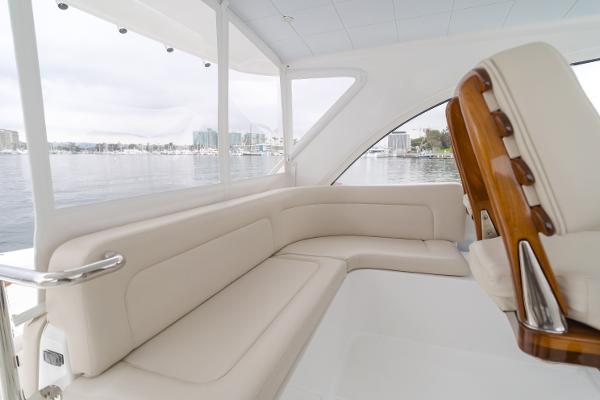 Slide: The Image of Luxurious interior of 2023 Mag Bay 42 Express yacht with cream seating and scenic view. - 35