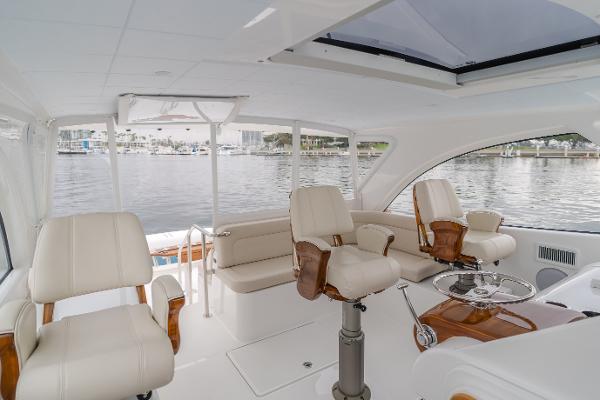 Slide: The Image of Luxurious interior of 2023 Mag Bay 42 Express yacht with plush seating and panoramic windows. - 37