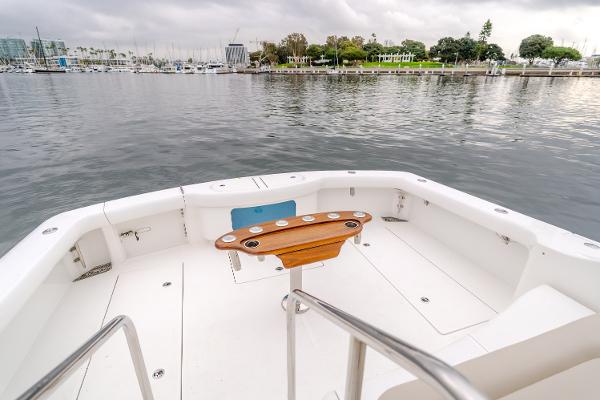 Slide: The Image of 2023 Mag Bay 42 Express boat deck with scenic waterfront view. - 38