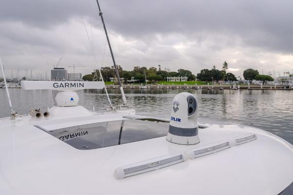 Slide: The Image of 2023 Mag Bay 42 Express boat with Garmin and FLIR equipment on a calm waterway. - 46
