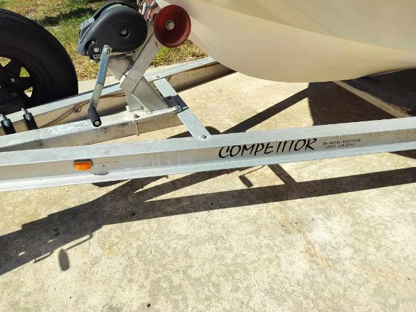 Slide: The Image of 1988 Mako 171 Center Console boat on a trailer labeled Competitor. - 14